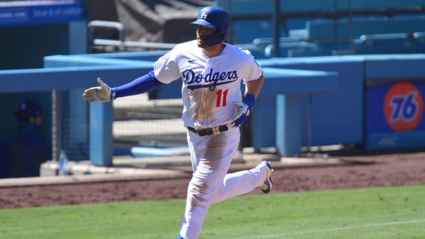 August 9, 2020; Los Angeles, California, USA; Los Angeles Dodgers designated hitter A.J. Pollock (11) rounds the bases after hitting a three run home run during the seventh inning against the San Francisco Giants at Dodger Stadium. Mandatory Credit: Gary A. Vasquez-USA TODAY Sports